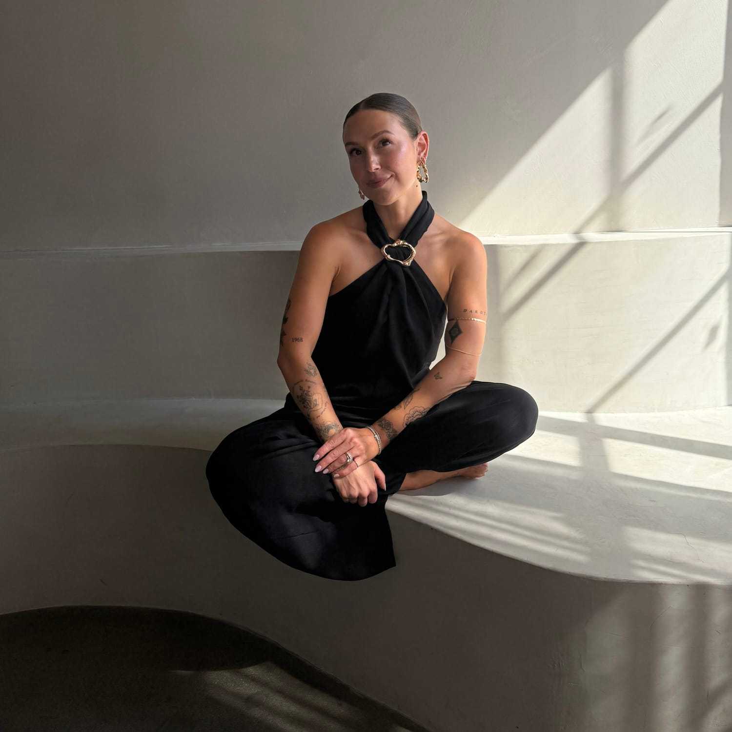 Portrait of Jessie Adams, a professional stylist at Stranded Salon, showcasing their expertise and style.