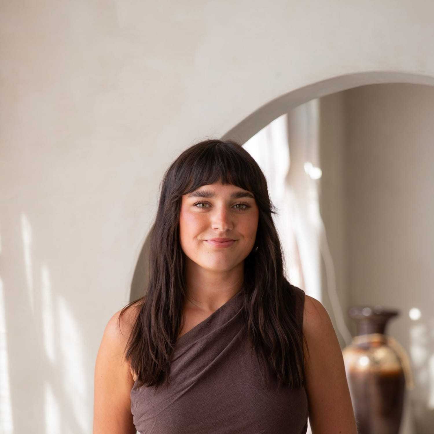 Portrait of Claire Powell, a professional stylist at Stranded Salon, showcasing their expertise and style.