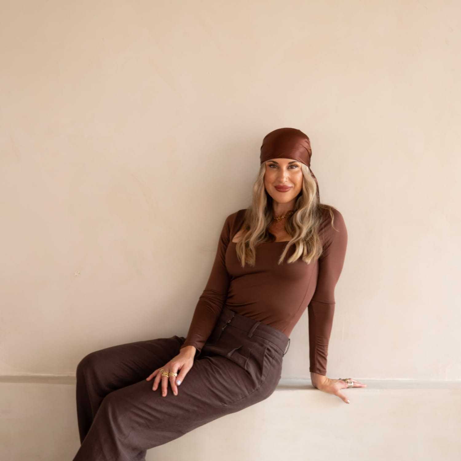 Portrait of Danielle Hogan, a professional stylist at Stranded Salon, showcasing their expertise and style.