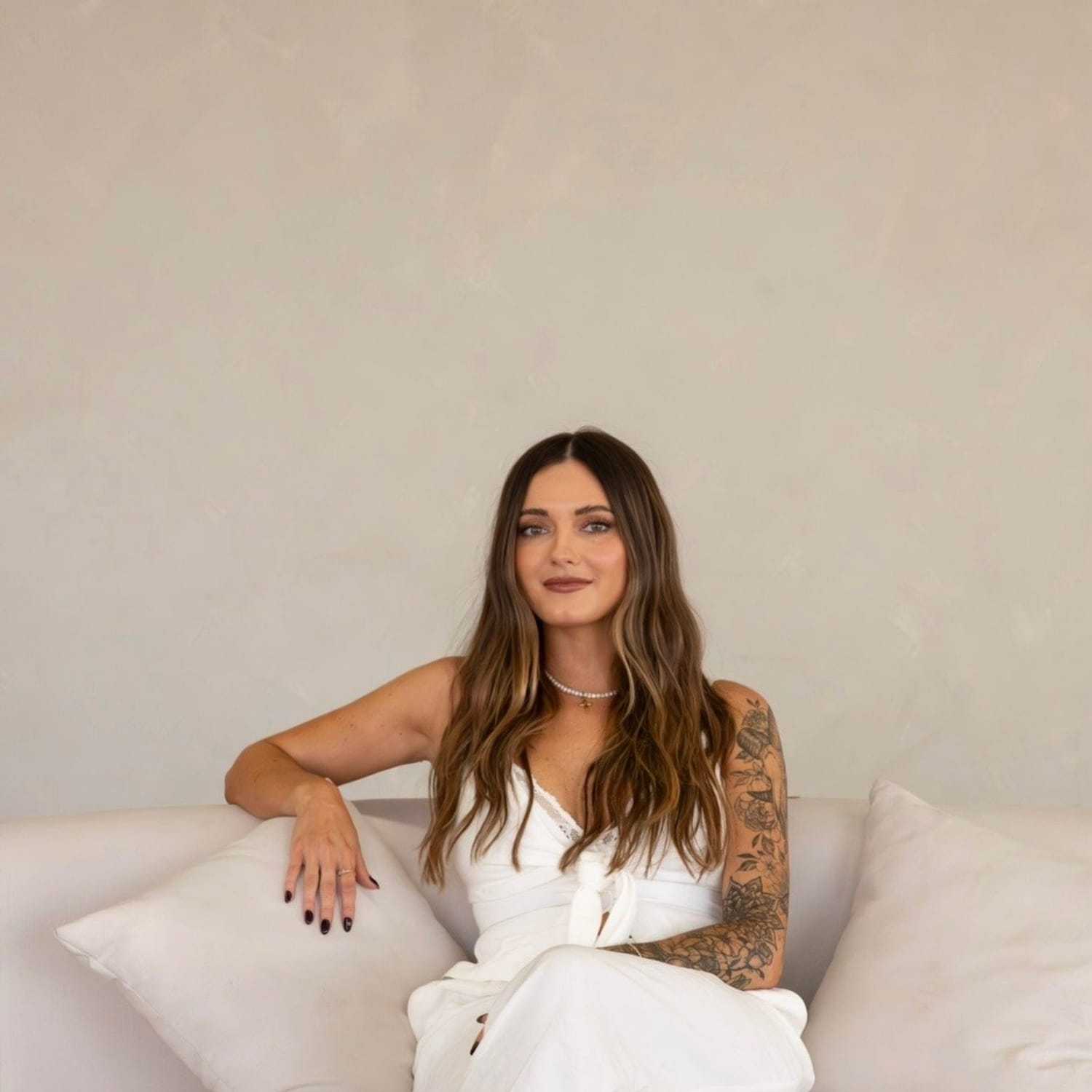 Portrait of Keyana Jalbert, a professional stylist at Stranded Salon, showcasing their expertise and style.